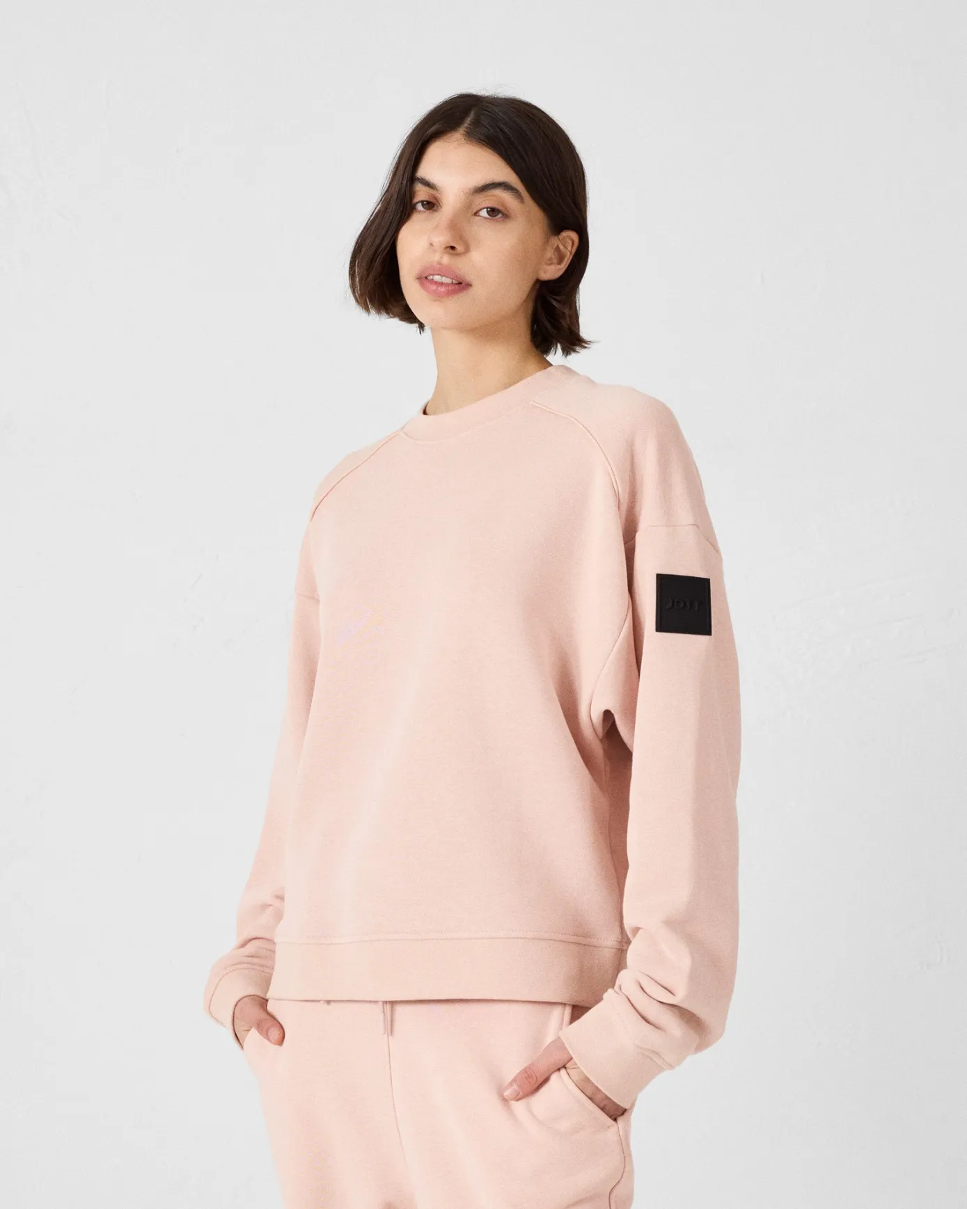 Sweat bimatière col rond Pêche clair Pinako